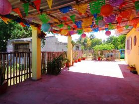 Patio dressed up for a fiesta with paper banners in a home in Yucatan, Mexico – Best Places In The World To Retire – International Living